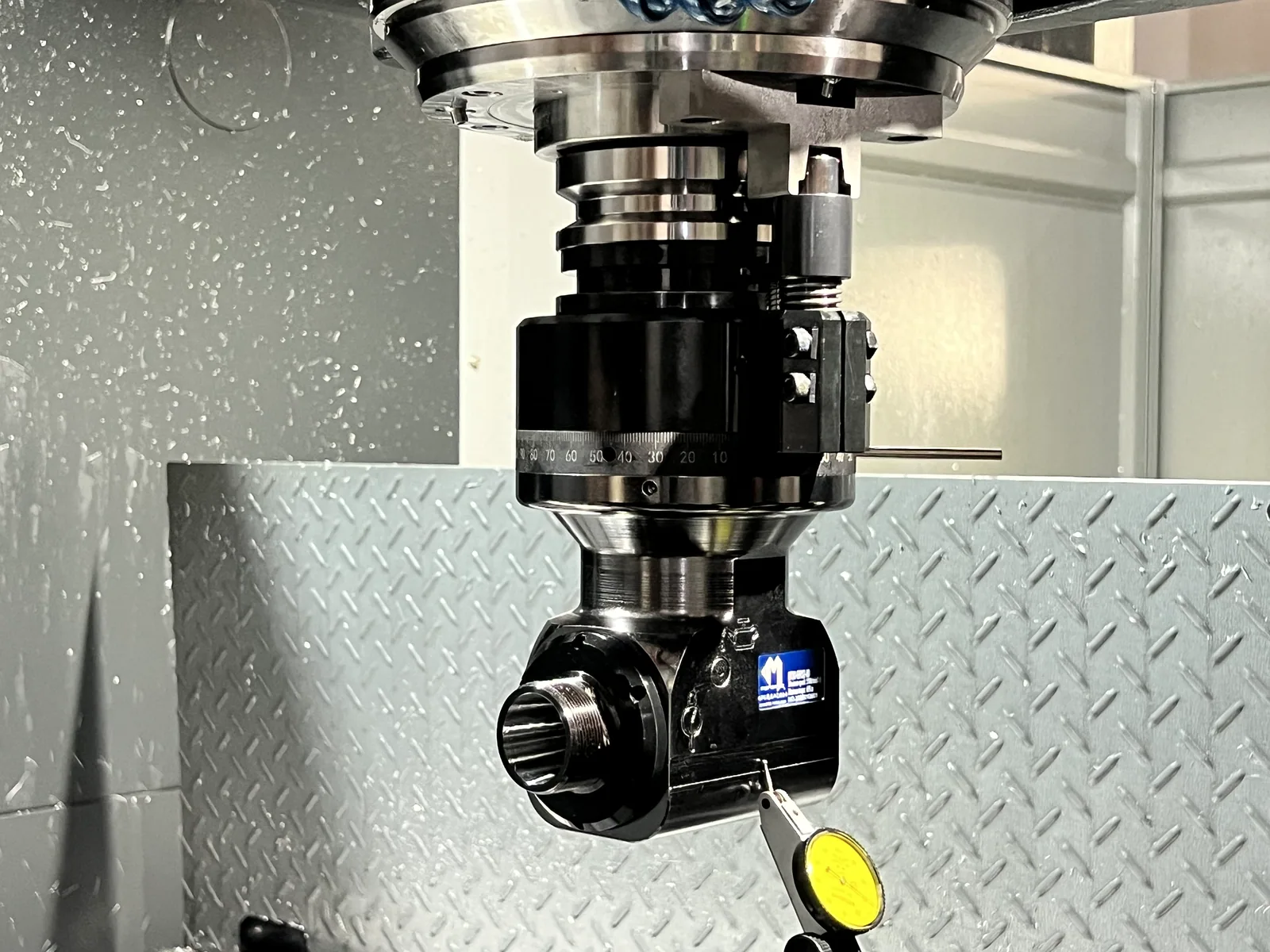 Mongtec angle head alignment checked with a dial indicator