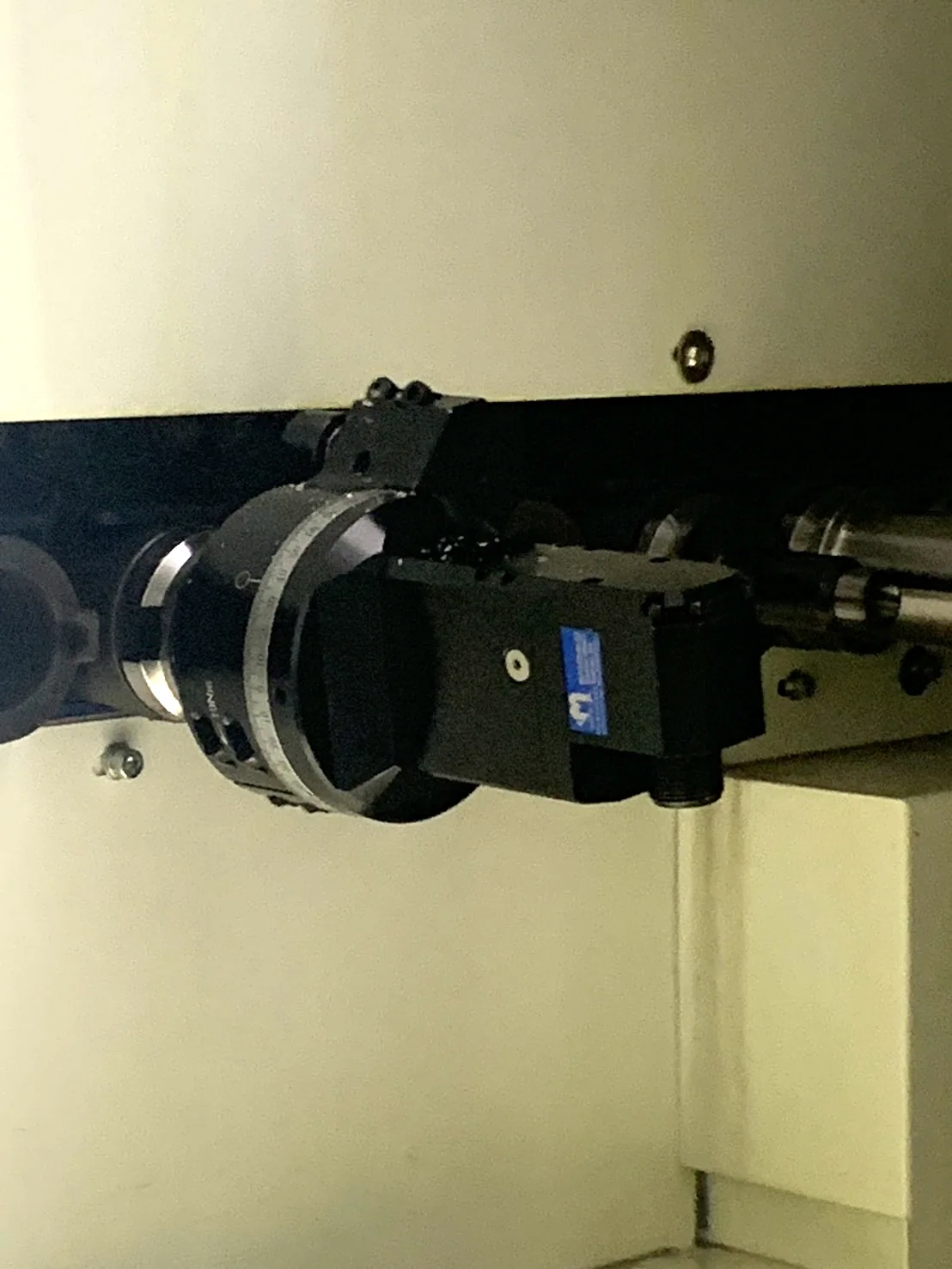 Mongtec angle head installed inside a machining-centre enclosure