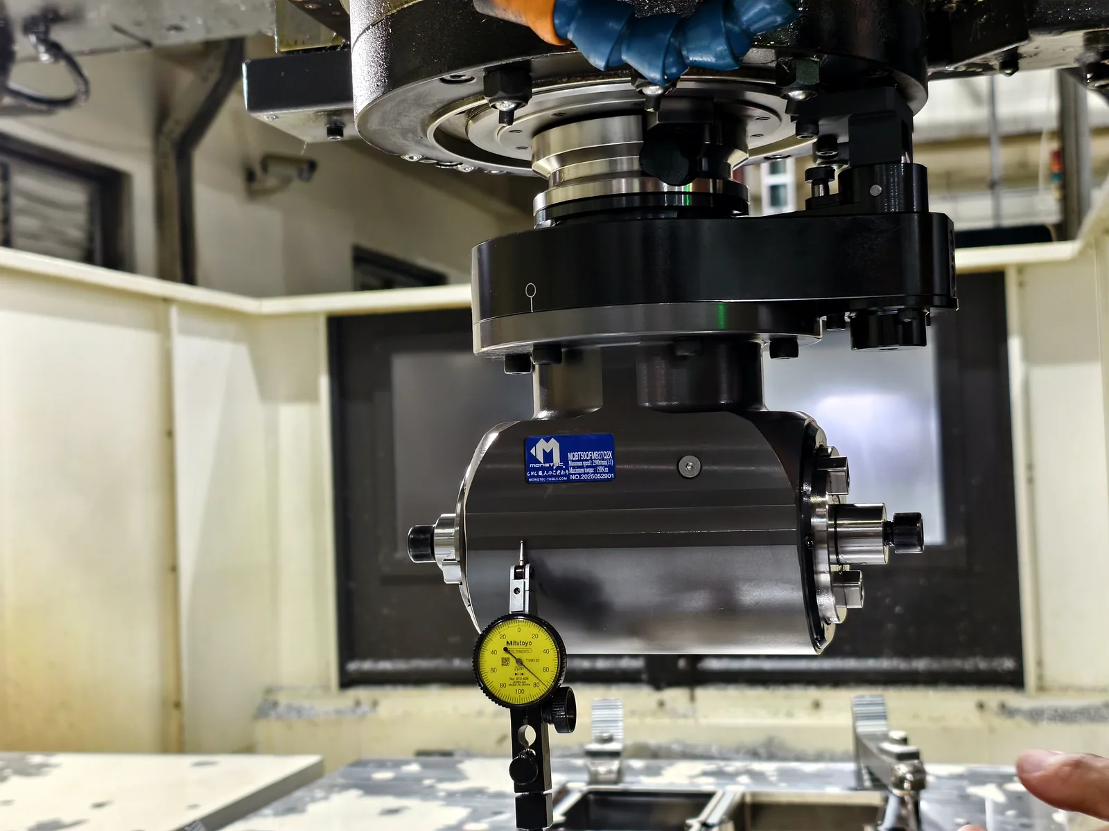 Mongtec angle head with dial indicator during machine setup