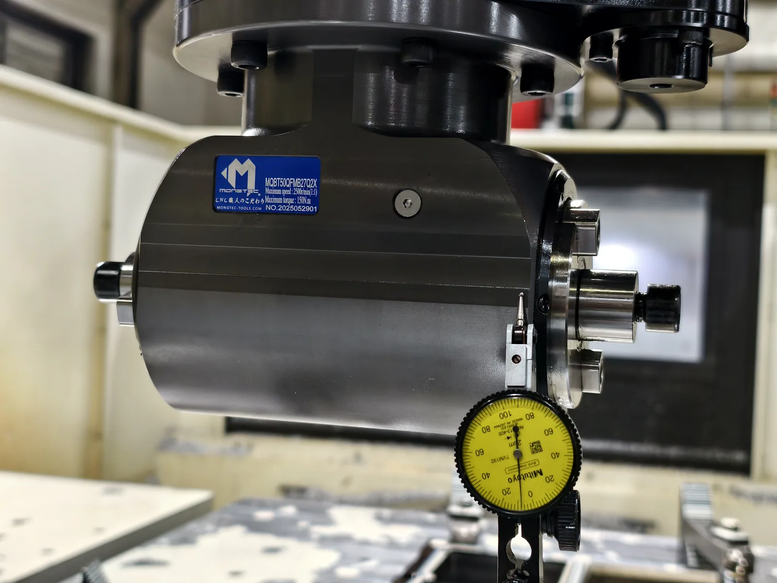 Dial indicator reading taken on a Mongtec angle head body