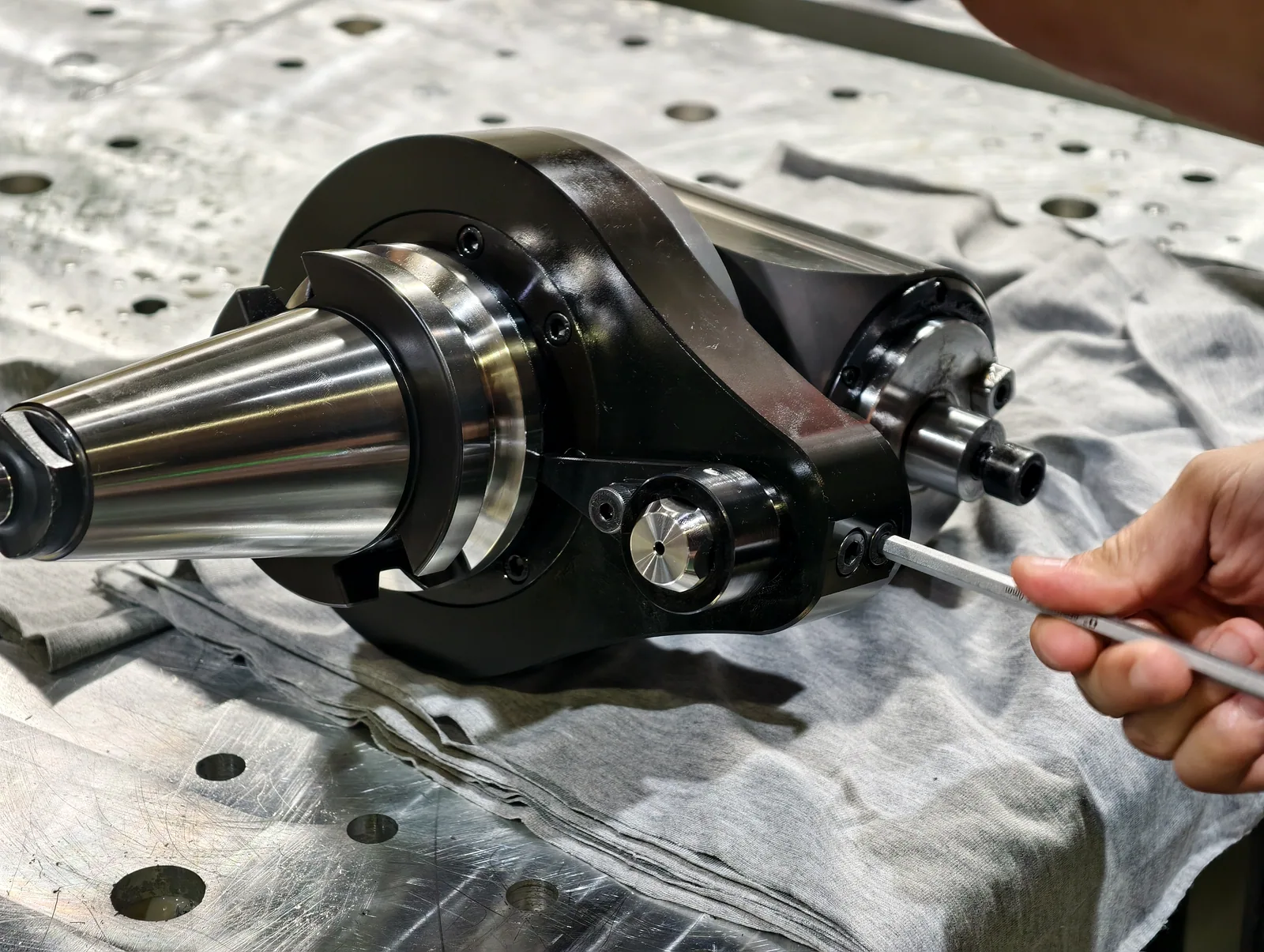 Mongtec angle head being set up on a machining-centre table