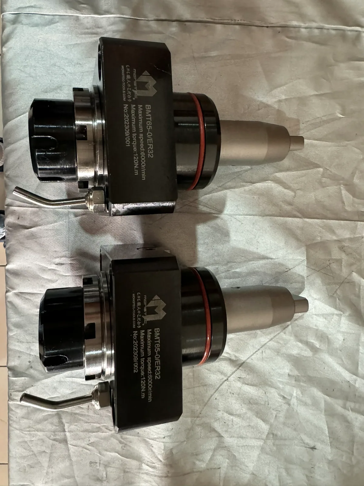 A pair of Mongtec BMT driven tool holders with coolant tubes